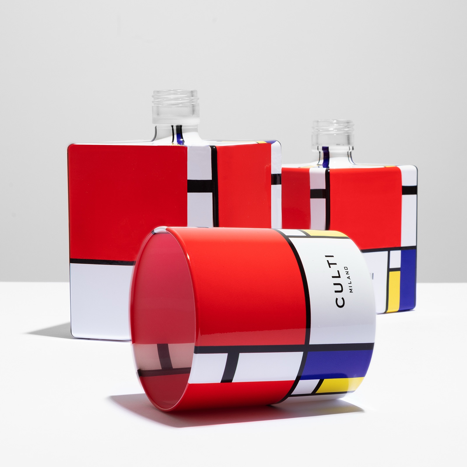 CULTI Milano Mondrian — cylindrical candle and square diffusers with the CULTI logo