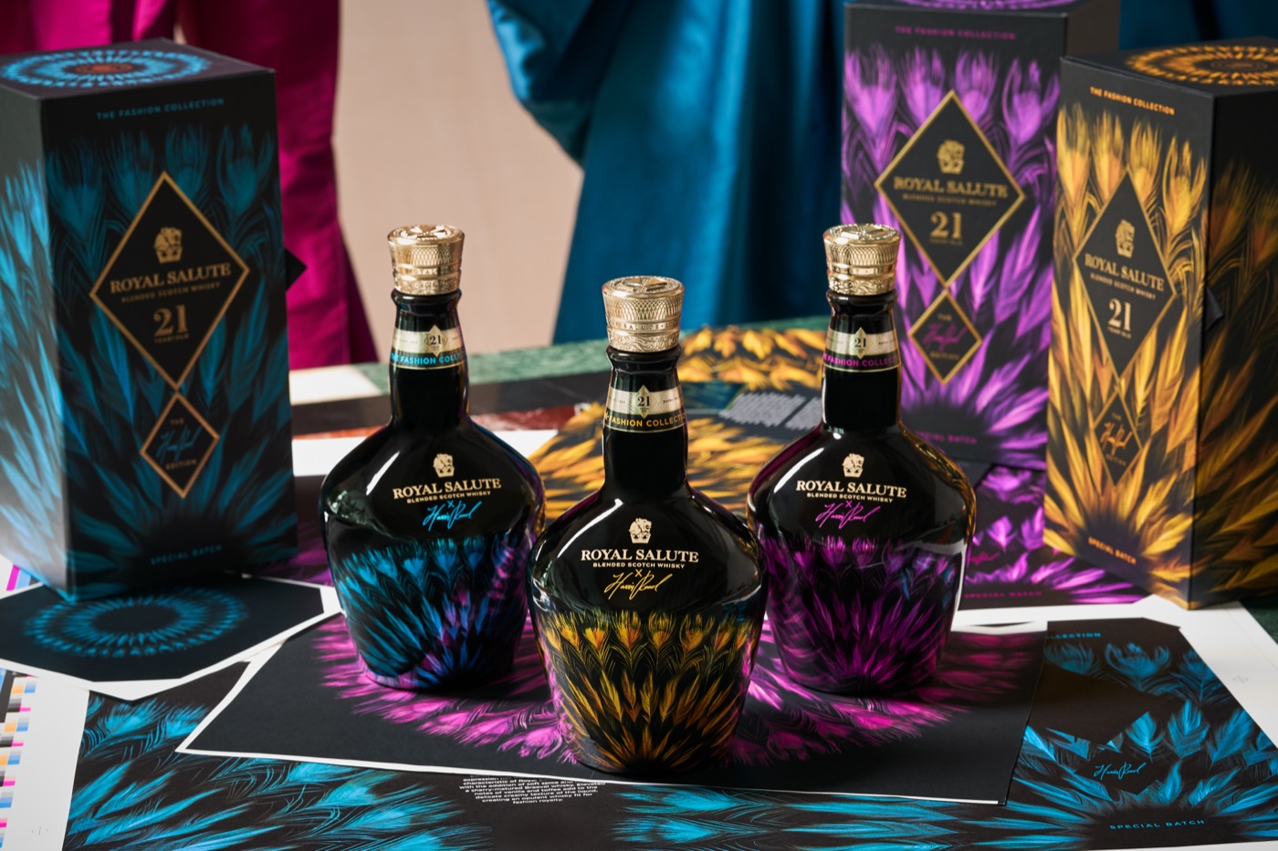 Whisky fashion editions with print proofs in the atelier — bold, detailed, full-colour artwork